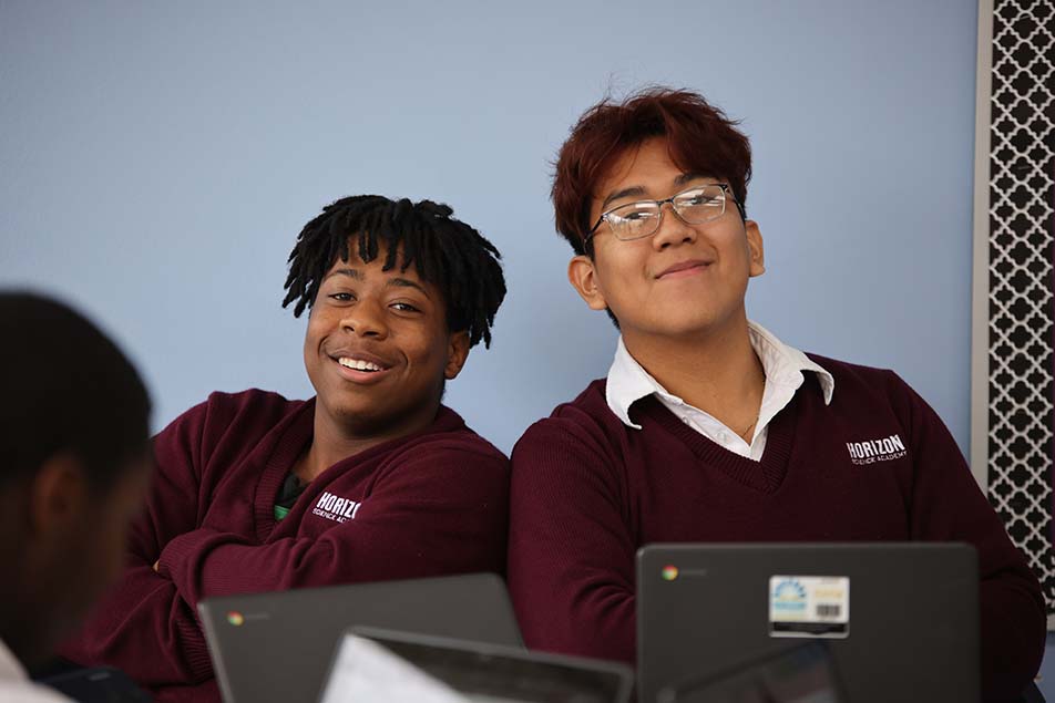 students and teacher working in classroom