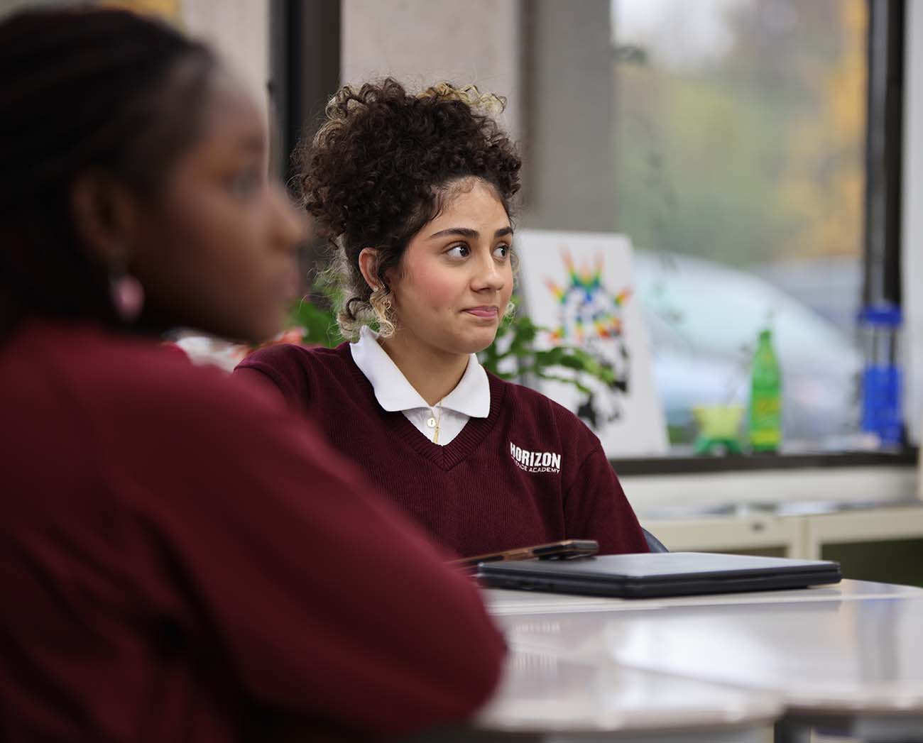 Smiling children together outdoors.